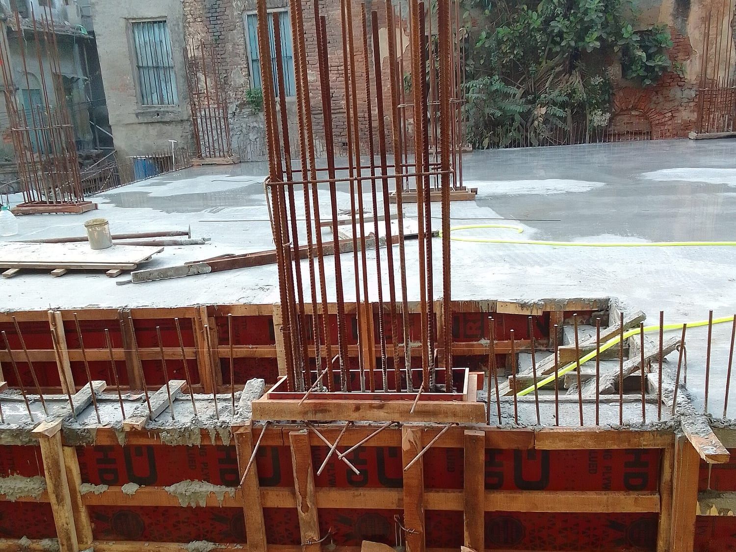 Reinforced concrete slab under construction, with timber formwork and steel reinforcement in place. Stand-in photograph.