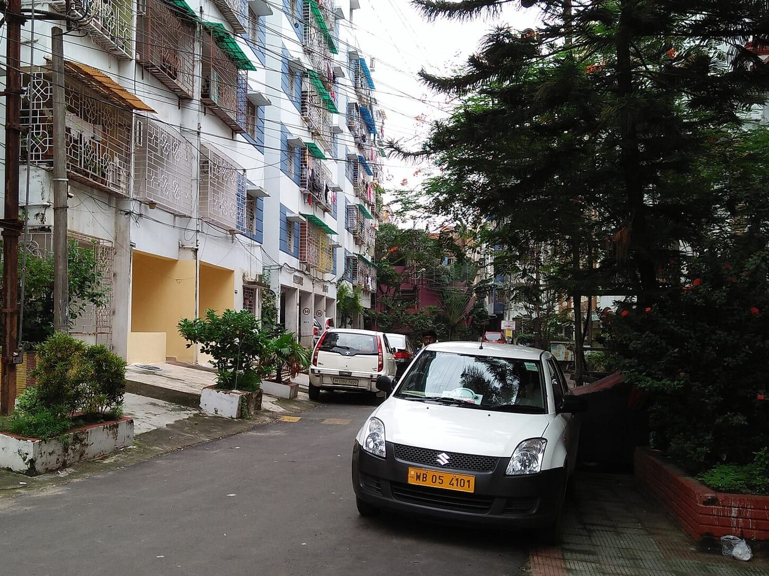 Cream and pink residential blocks seen from the approach road. Stand-in photograph.
